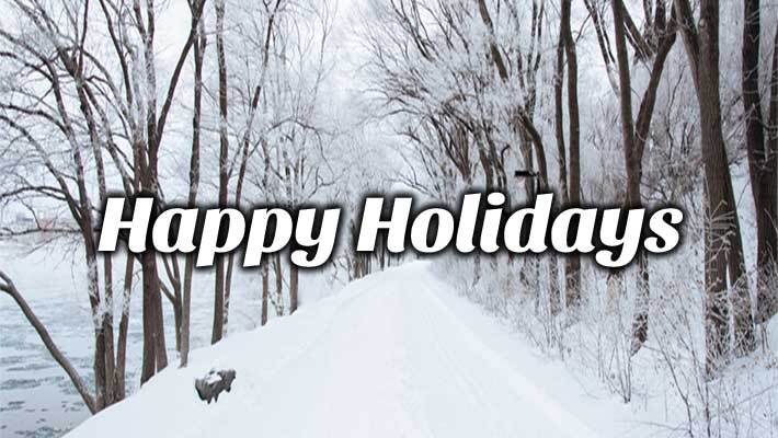 Snow covered path in a forest with the text, Happy Holidays. 