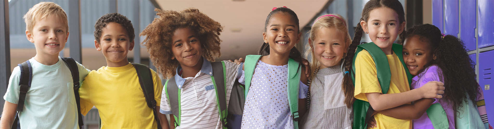 Group of children hugging.